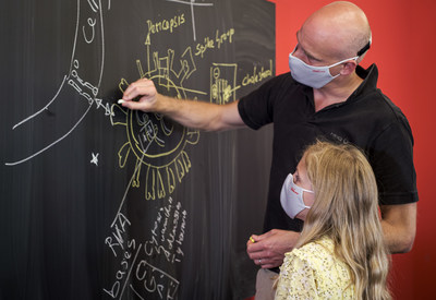 caption: HeiQ co-founder and group CEO Carlo Centonze explains the mechanism of HeiQ Viroblock to his daughter. (Photo from HeiQ)
